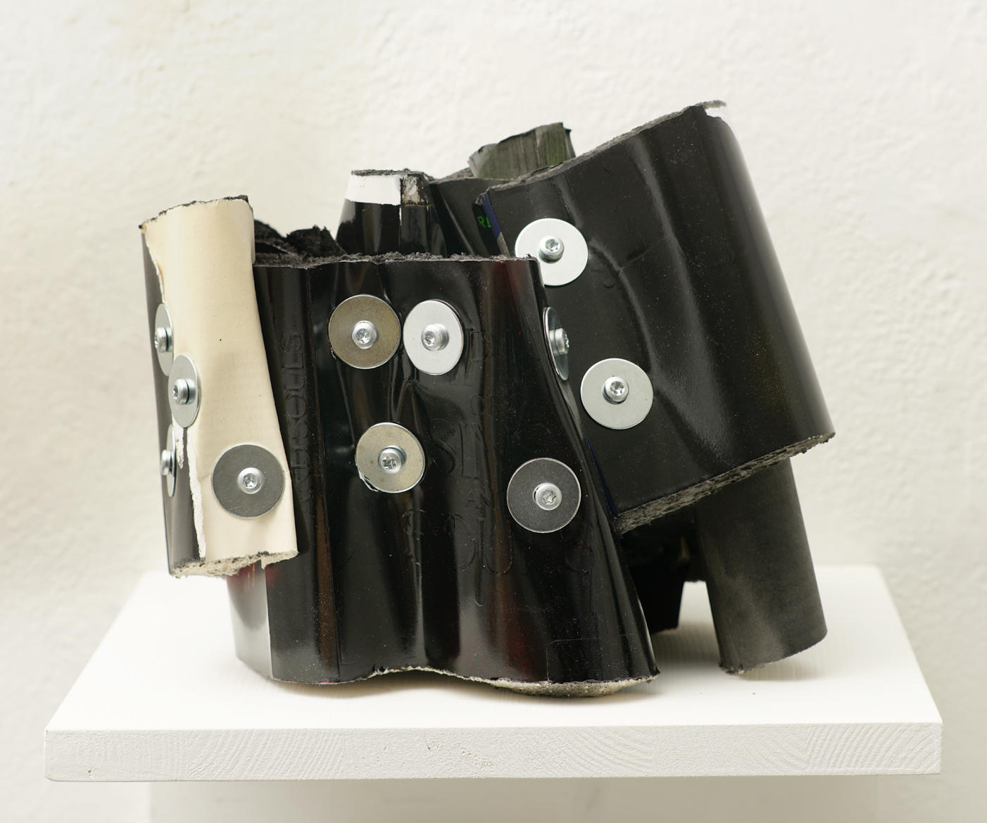 Empire of Sins and Souls, cut books (varnished black), screws, app.: 26 x 20 x 20 cm, 2025