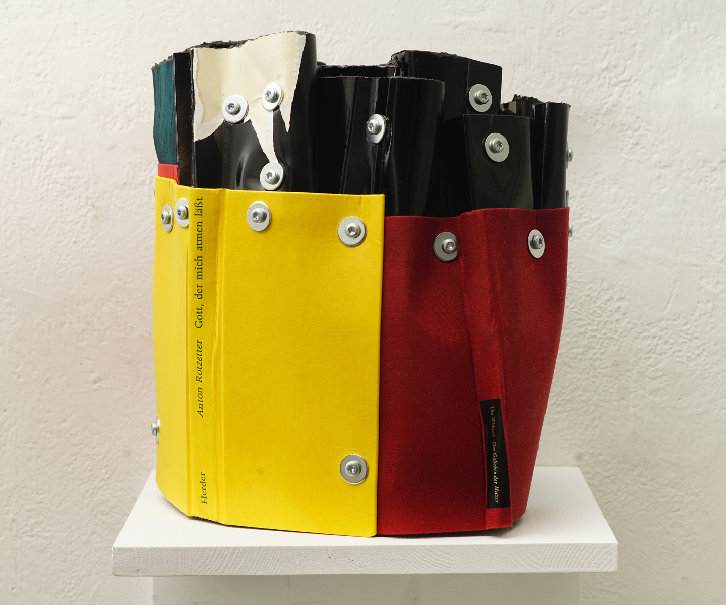The Family Guest, cut books (varnished black), book covers, screws, app.: 30 x 35 x 26 cm, 2025